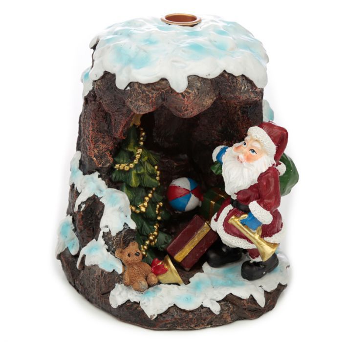 Hand-painted festive backflow incense burner shaped like a snowy Christmas grotto with Santa Claus.