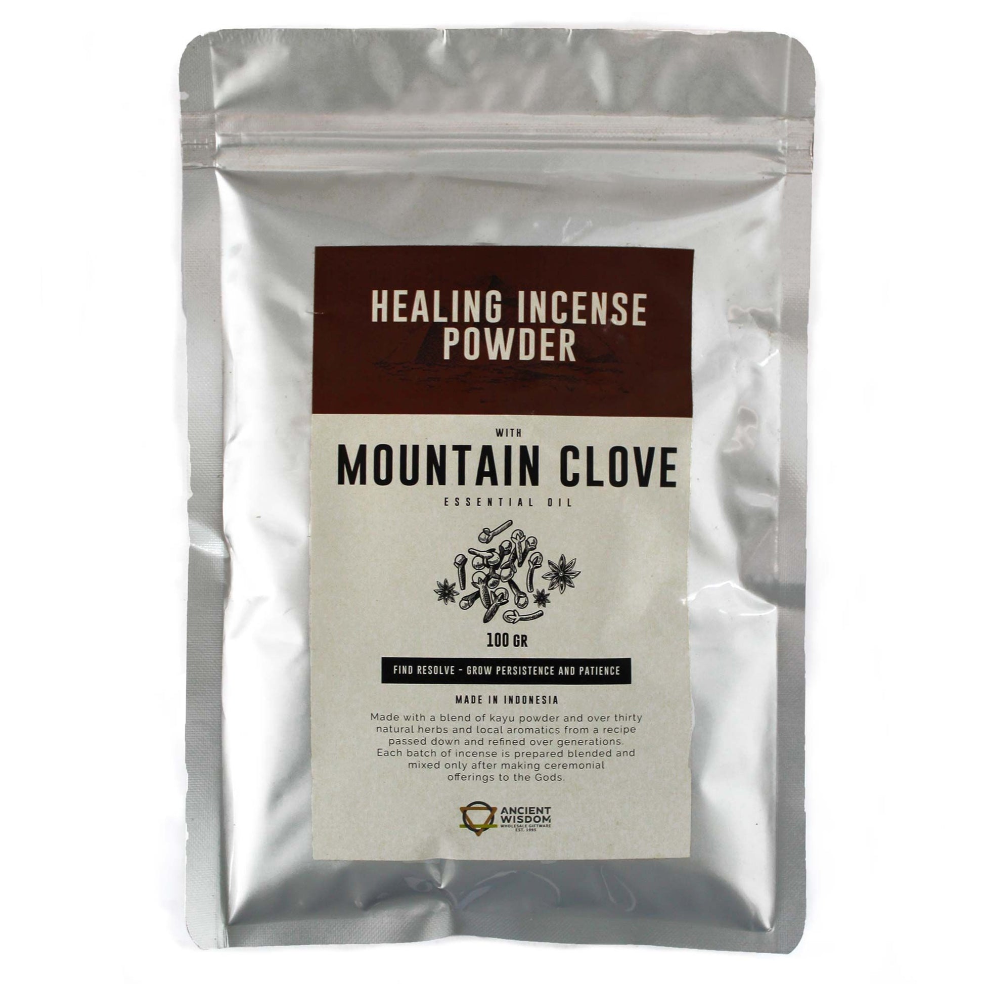 Finely ground aromatic mountain clove incense powder in a pile, showing a rich brown texture for ritual use.