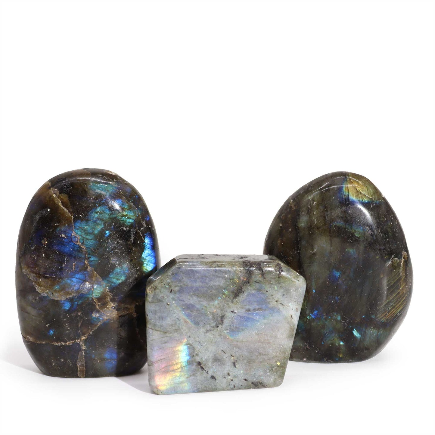 Smooth, polished Madagascar labradorite tomb stone showing a vibrant iridescent blue and green flash.