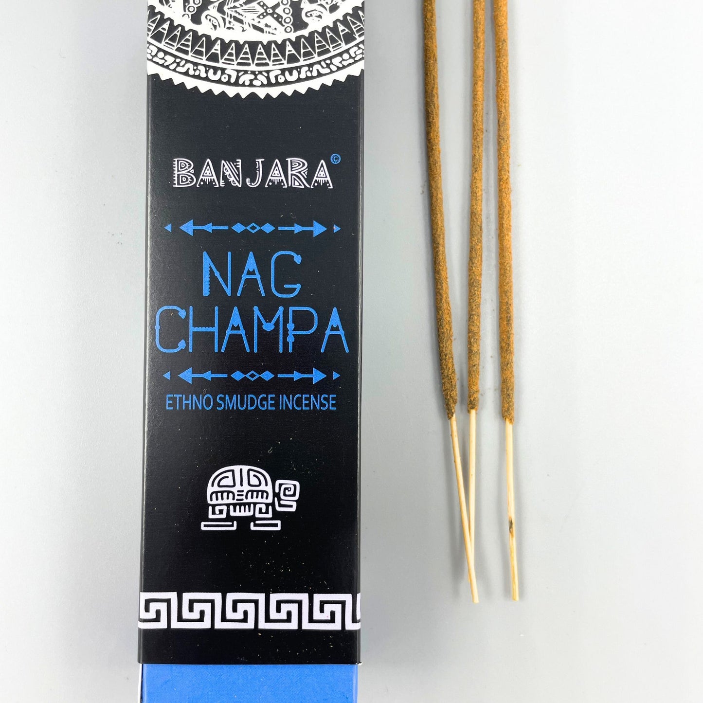 Handcrafted tribal smudge incense sticks in decorative packaging featuring intricate traditional art patterns.