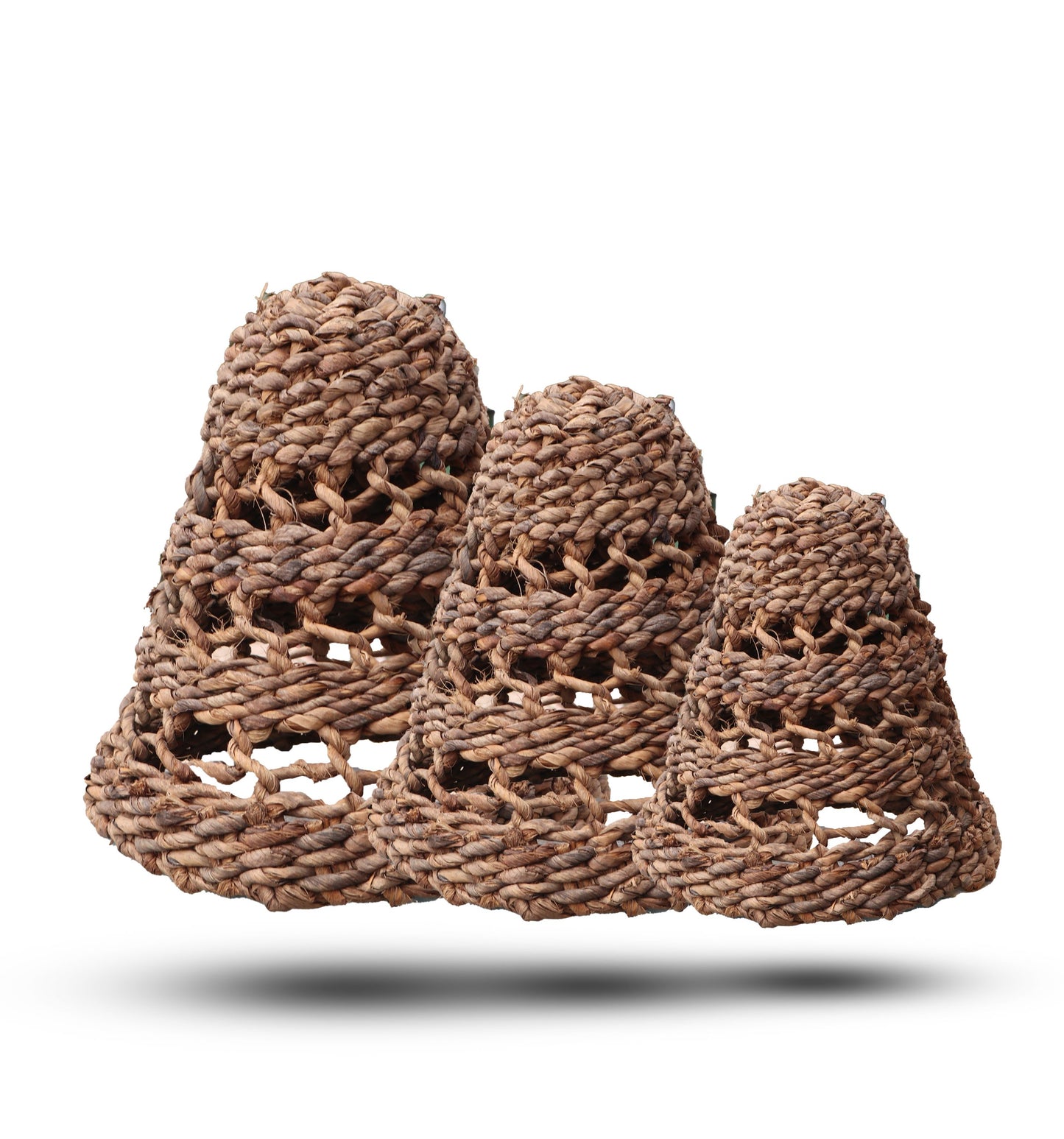Set of three handcrafted pendant lamp shades made from natural woven banana leaf and dark hitam raffia fibers.