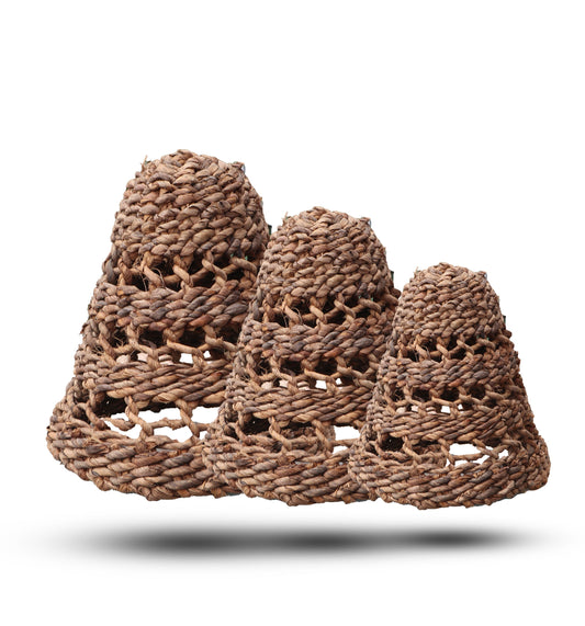 Set of three handcrafted pendant lamp shades made from natural woven banana leaf and dark hitam raffia fibers.