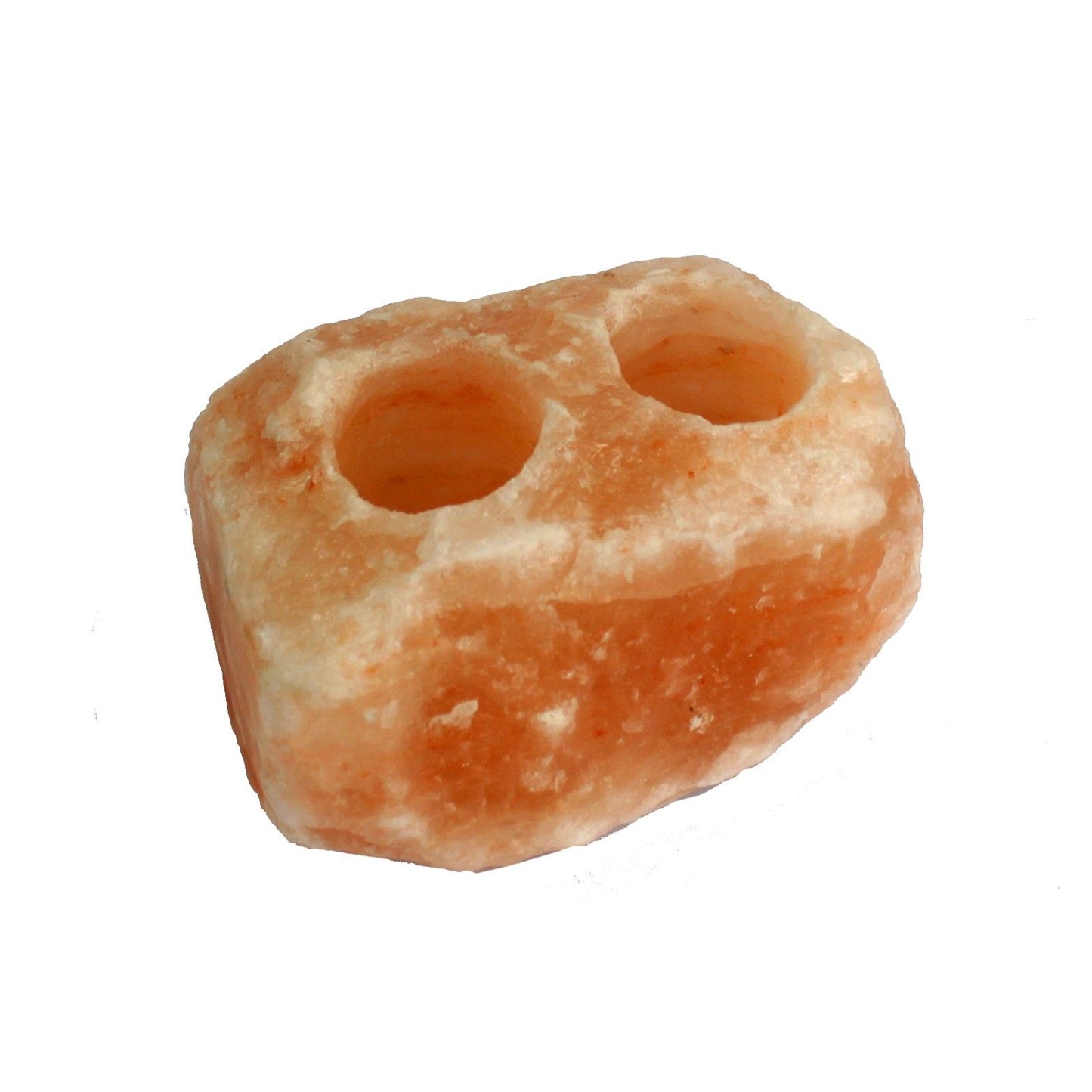 Hand-carved natural orange Himalayan salt rock candle holder with two circular tea light holes carved into the top.