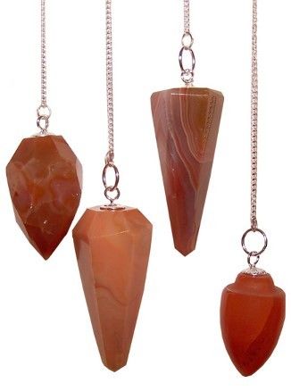 Facetted carnelian gemstone pendulum hanging from a silver-toned chain with a small bead at the end.