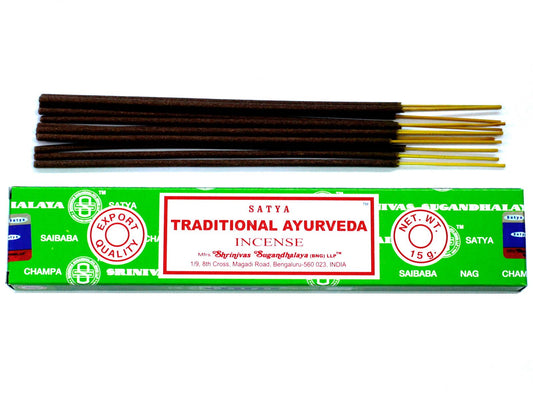 Blue and white branded box of Ayurveda incense sticks resting on a neutral surface.