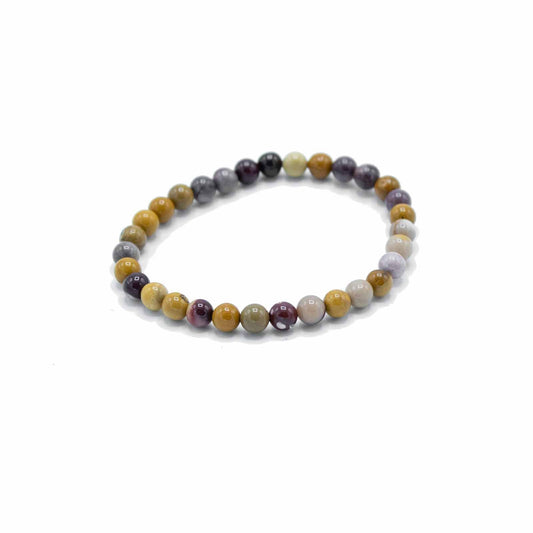 Genuine Rare Mookaite gemstone bead bracelet for wisdom and manifestation on a neutral background.