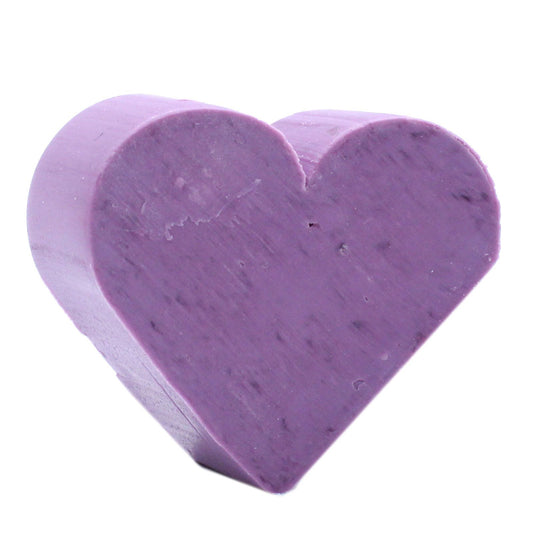 Small purple heart-shaped soaps with a smooth texture, perfect for a decorative bathroom display.