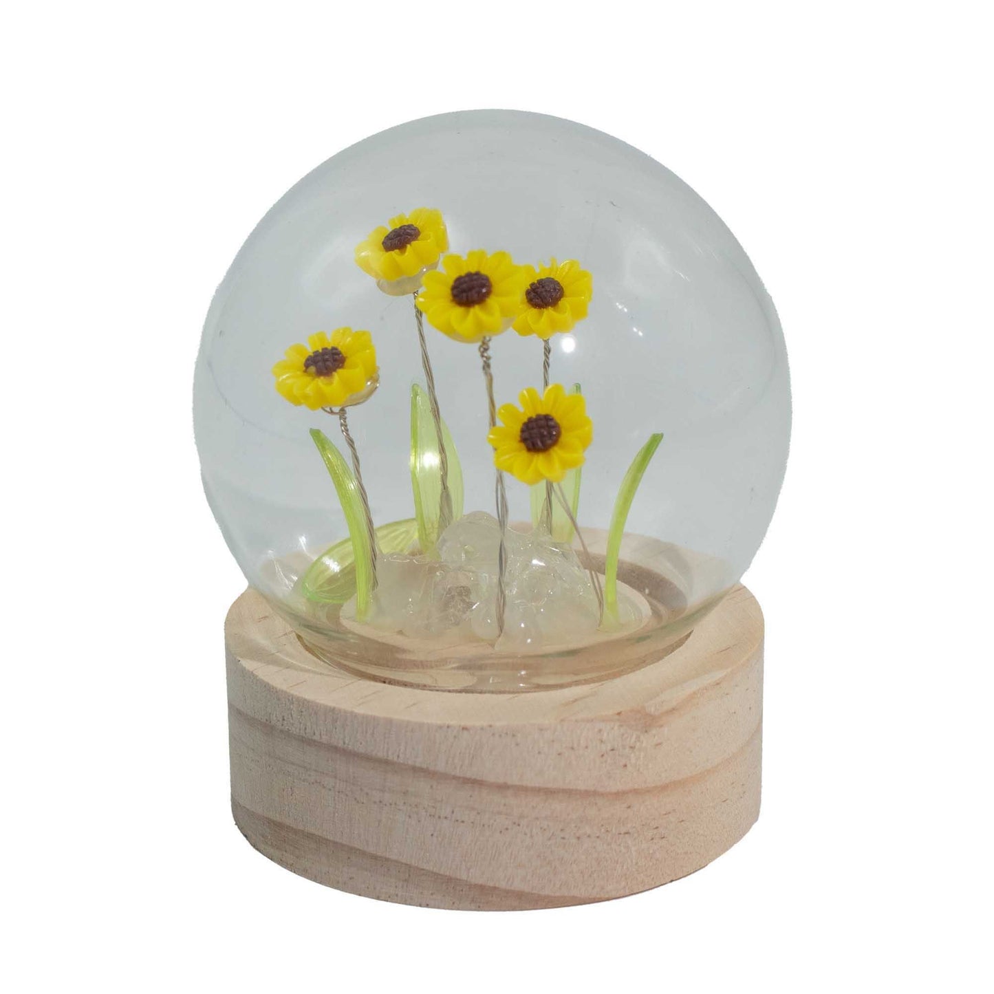Five bright yellow sunflower stems enclosed in a glass dome with warm glowing LED lights.