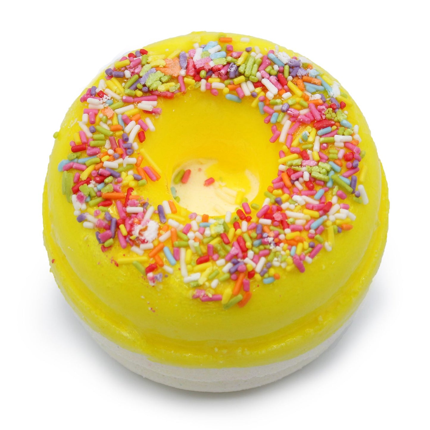 Two colourful bath fizzers shaped like donuts with yellow icing and white drizzle on a plain background.