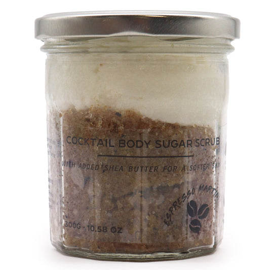 Close-up of textured sugar body scrub in a jar, showing a rich coffee-brown colour and exfoliating granules.