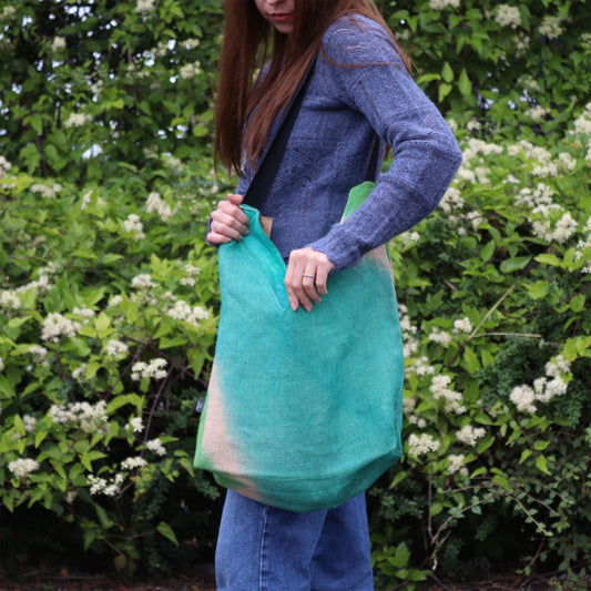 Luxurious teal shoulder tote bag handcrafted from soft eco-friendly jute and cotton blend fabric.