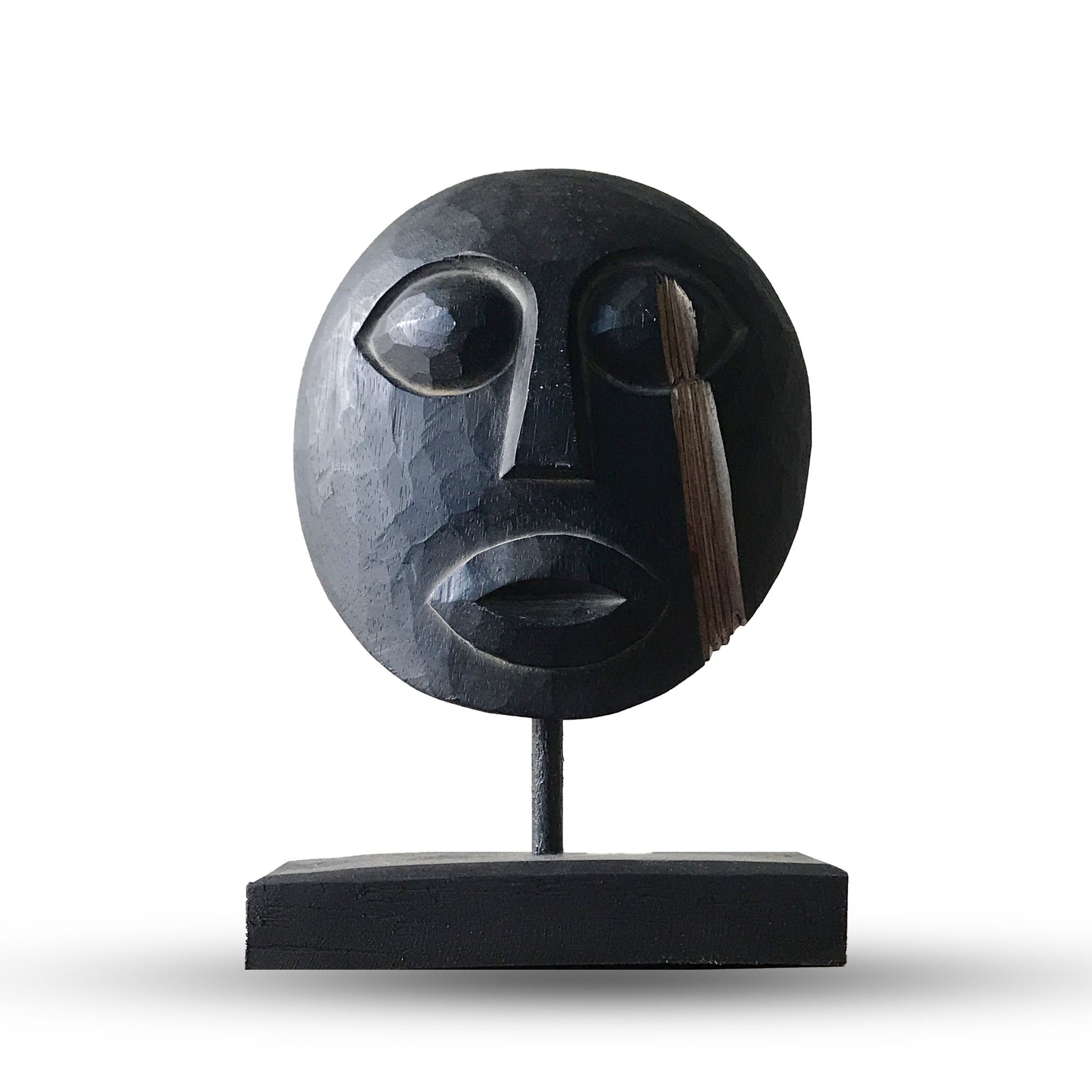Handcarved black wooden Timor tribal mask with intricate traditional patterns and a modern finish.