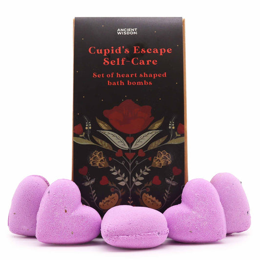Gift set containing heart-shaped bath bombs with dried lavender botanicals in a decorative box.