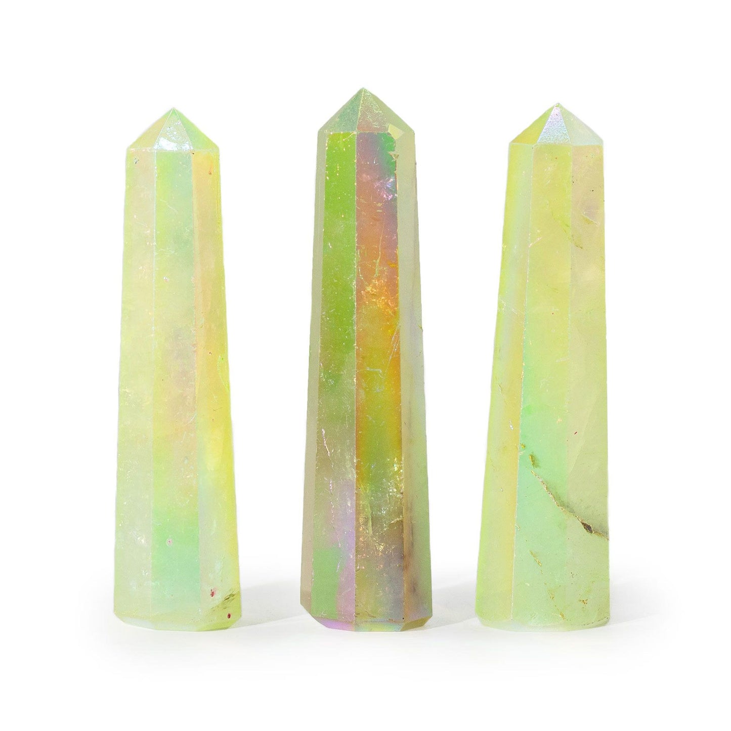 A polished pale green aurora crystal quartz gemstone obelisk point standing upright with an iridescent luminous finish.