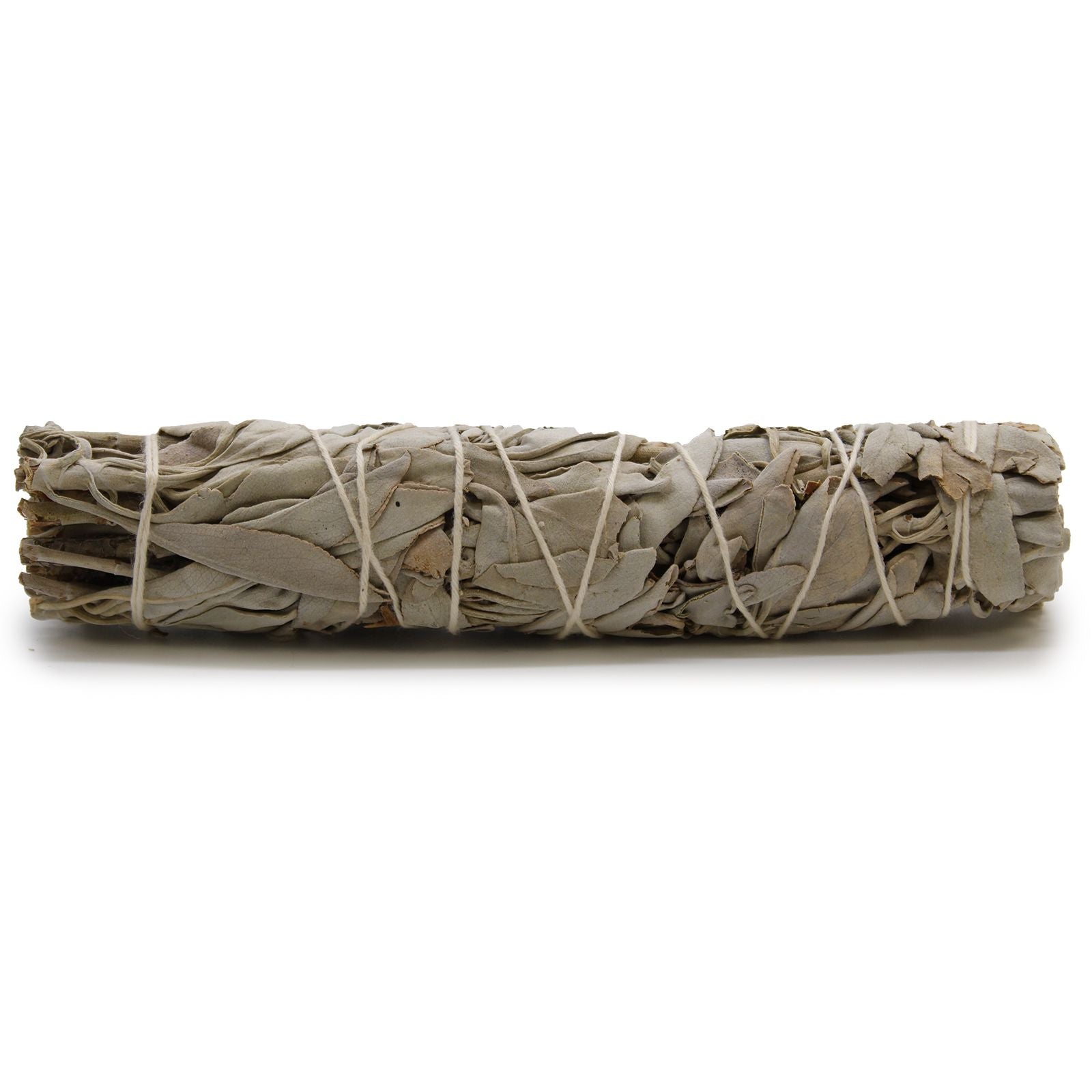 A large bundle of dried white sage leaves tied together with string for smudging and space clearing.