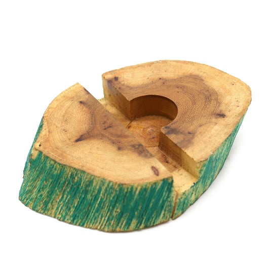 Large hand-carved Gamal wood mobile phone holder with a unique greenwash finish on a wooden surface.