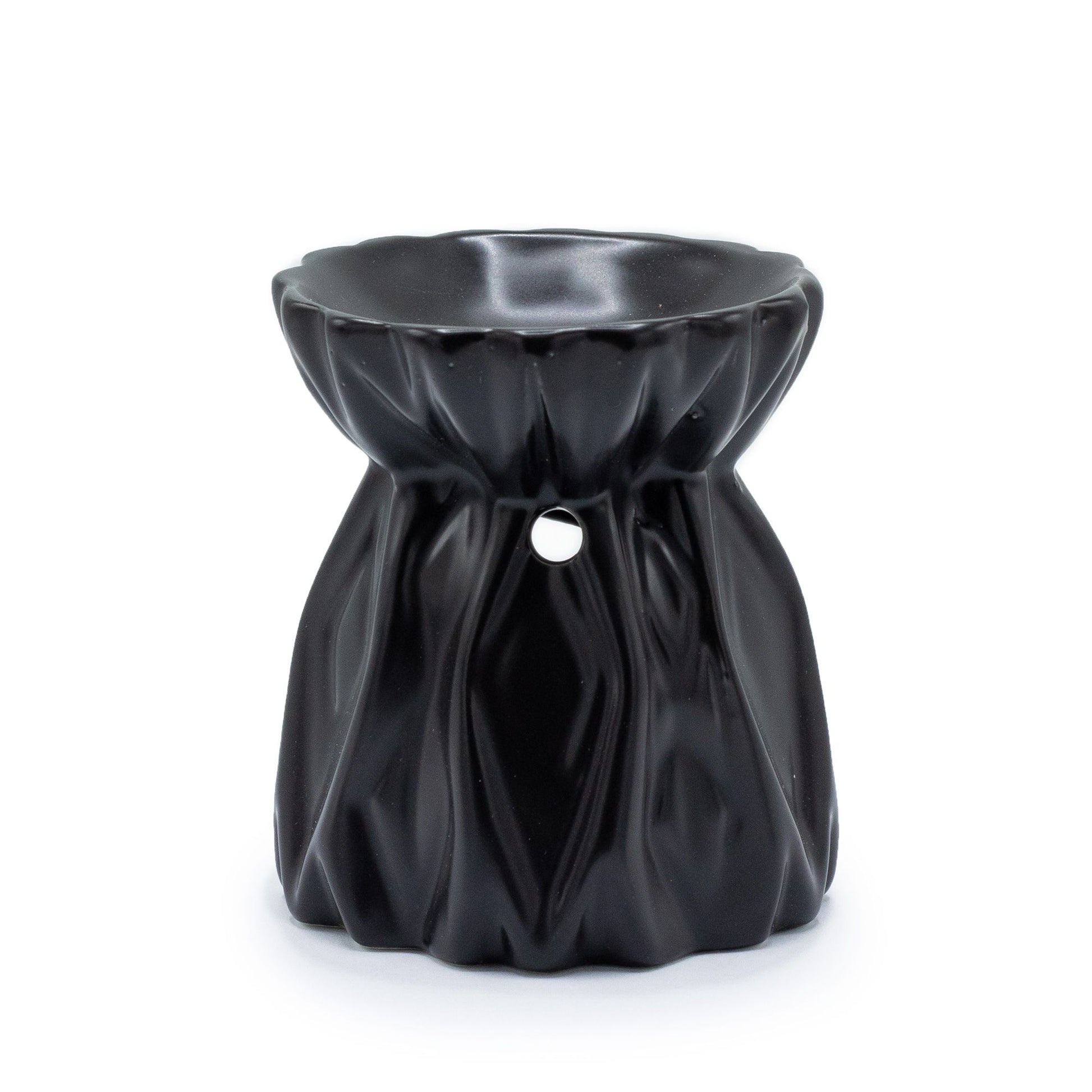 Minimalist black ceramic oil burner with a modern geometric cut-out design and a deep bowl for oils.