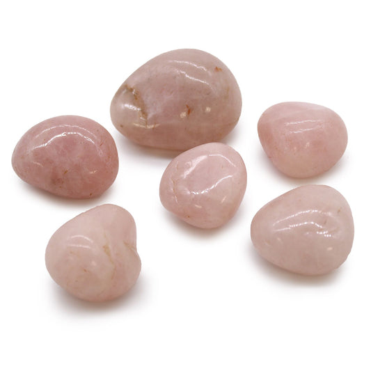 A collection of smooth, highly polished large pink rose quartz tumble stones from Africa.