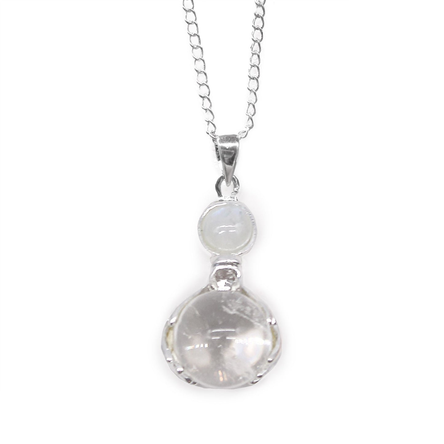 Detailed silver-tone healing hands cradling a clear, polished Rock Quartz gemstone point pendant.