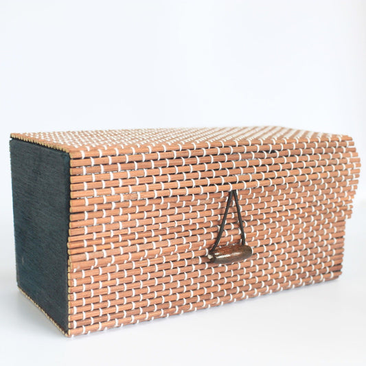 Handcrafted rectangular light brown bamboo gift box with a natural woven texture and a simple lid closure.