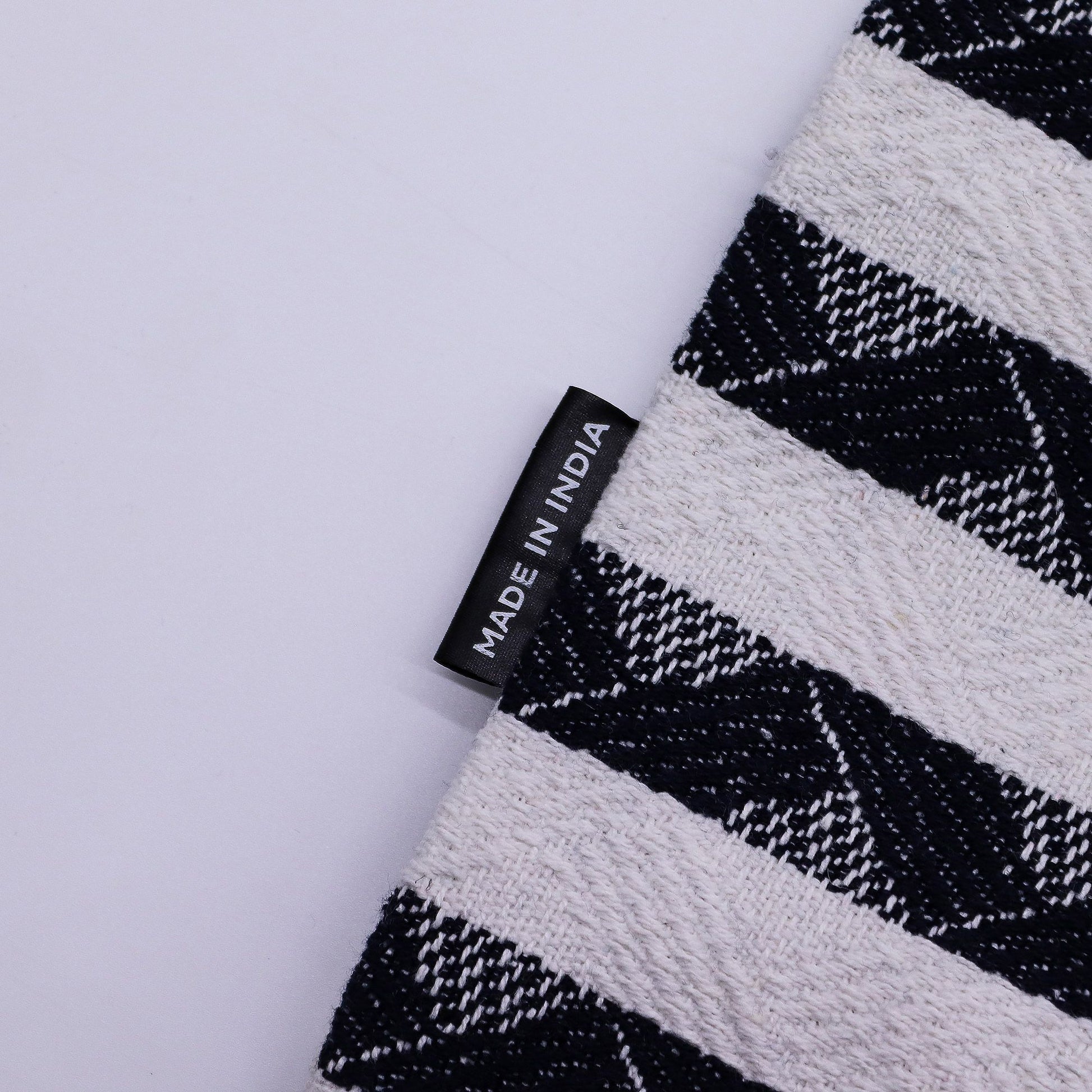 Spacious jacquard fabric carryall bag featuring a clean striped pattern and durable woven handles.
