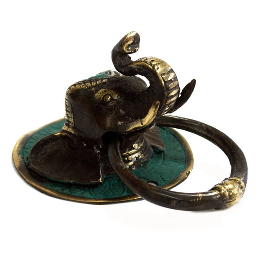 Detailed brass door knocker shaped like an elephant's head with a circular knocking ring.