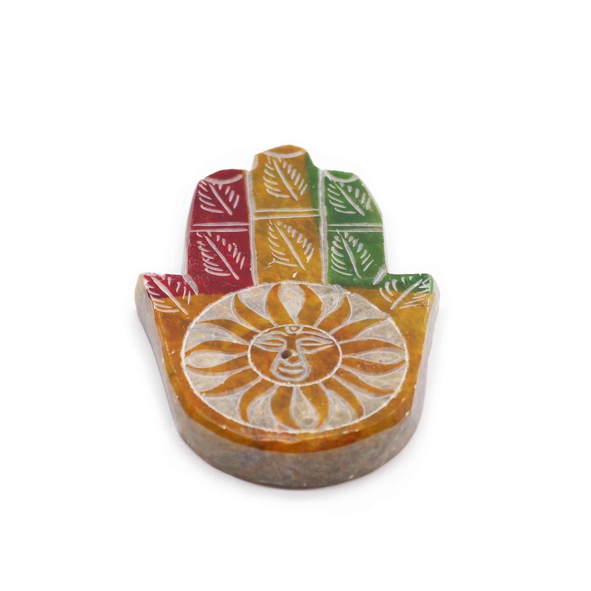 Carved grey soapstone incense holder in the shape of a Hamsa hand featuring a central sun face design.