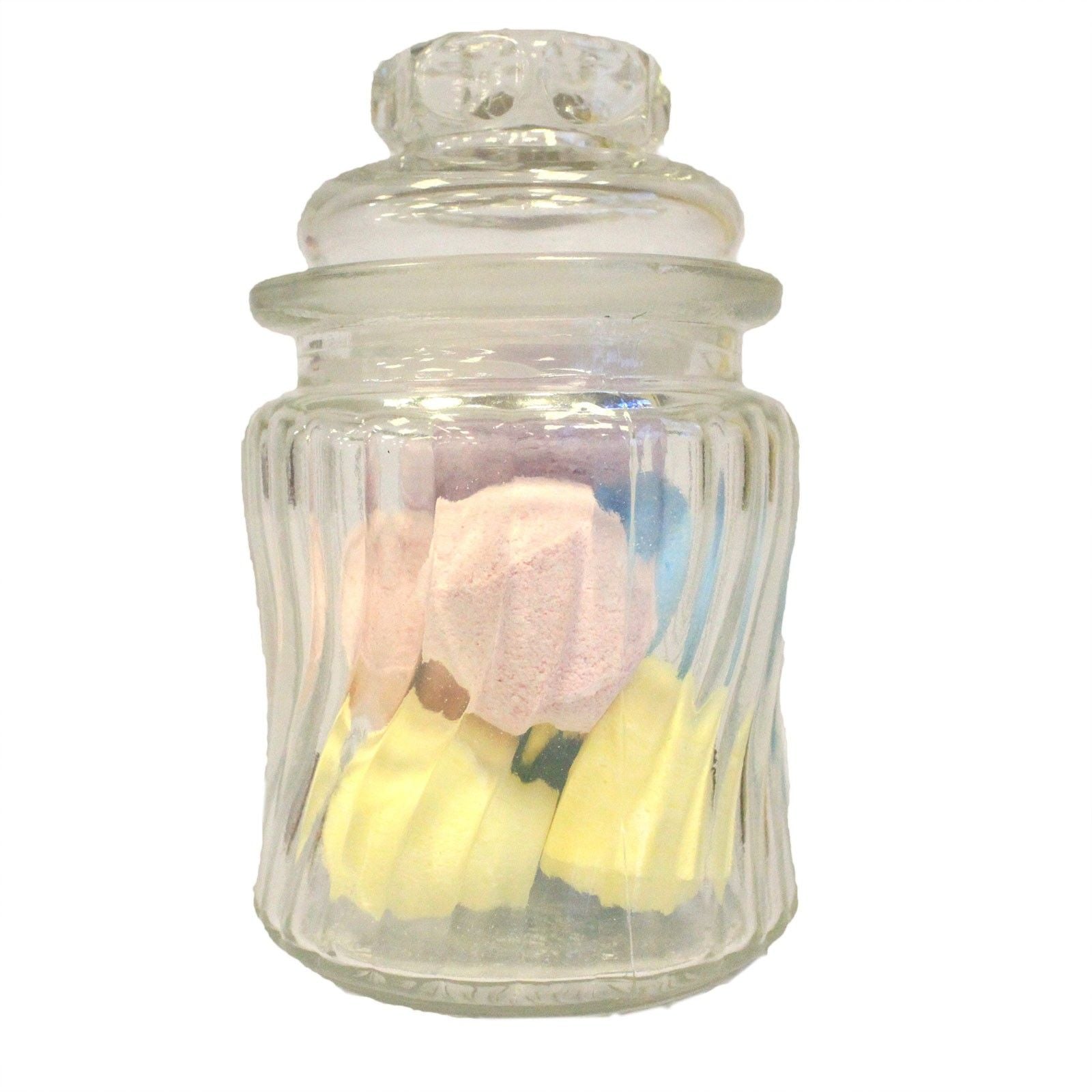 Elegant clear glass jar with a decorative swirl ribbed pattern and a matching glass lid.