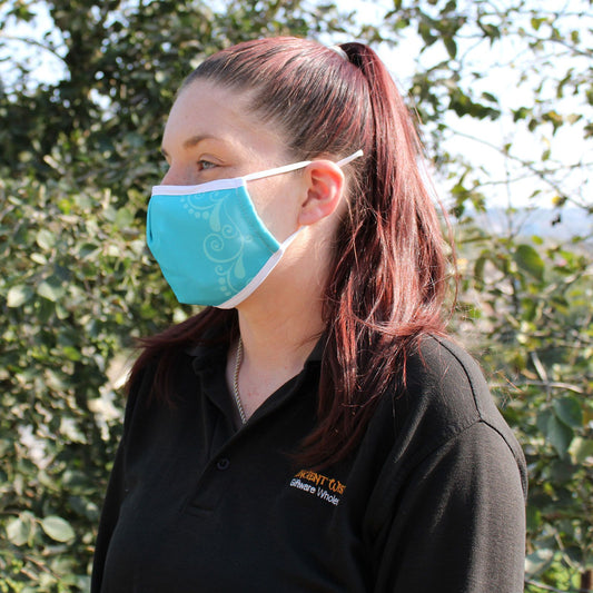 Adult-sized reusable fabric face covering featuring a vibrant blue butterfly pattern on a dark background.