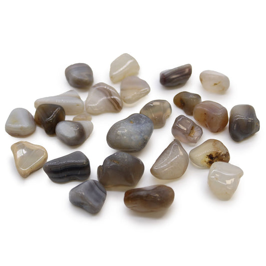 Small polished grey and blue-grey Botswana agate tumble stones with natural white and brown inclusions.