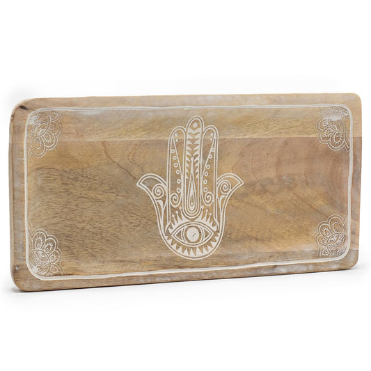 Long rectangular whitewashed wooden tray featuring an intricately carved Hamsa hand design in the centre.