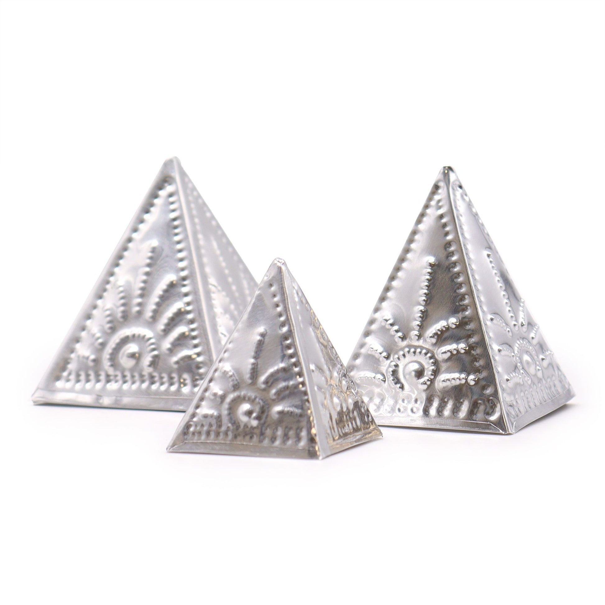 Set of three unpainted wooden pyramid moulds for making custom incense cones on a neutral background.
