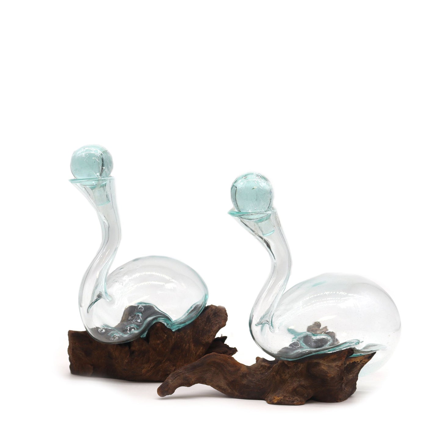Unique wine decanter made of recycled molten glass hand-blown over a natural piece of reclaimed wood.