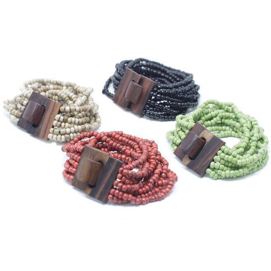 Detailed view of an elasticated multi-bead bangle featuring assorted colourful beads and a natural wooden clasp.