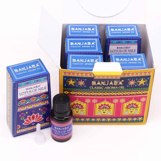 A 10ml bottle of blue Lotus of the Nile Indian fragrance oil with decorative label and dropper cap.
