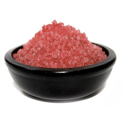 Close-up of small, textured purple simmering granules with a rich aromatic scent for home fragrancing.