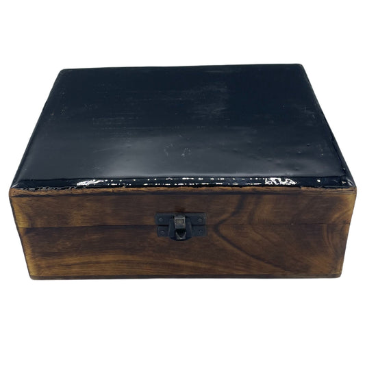 Sleek large rectangular black wooden storage box with a glossy ceramic glazed lid and natural wood base.