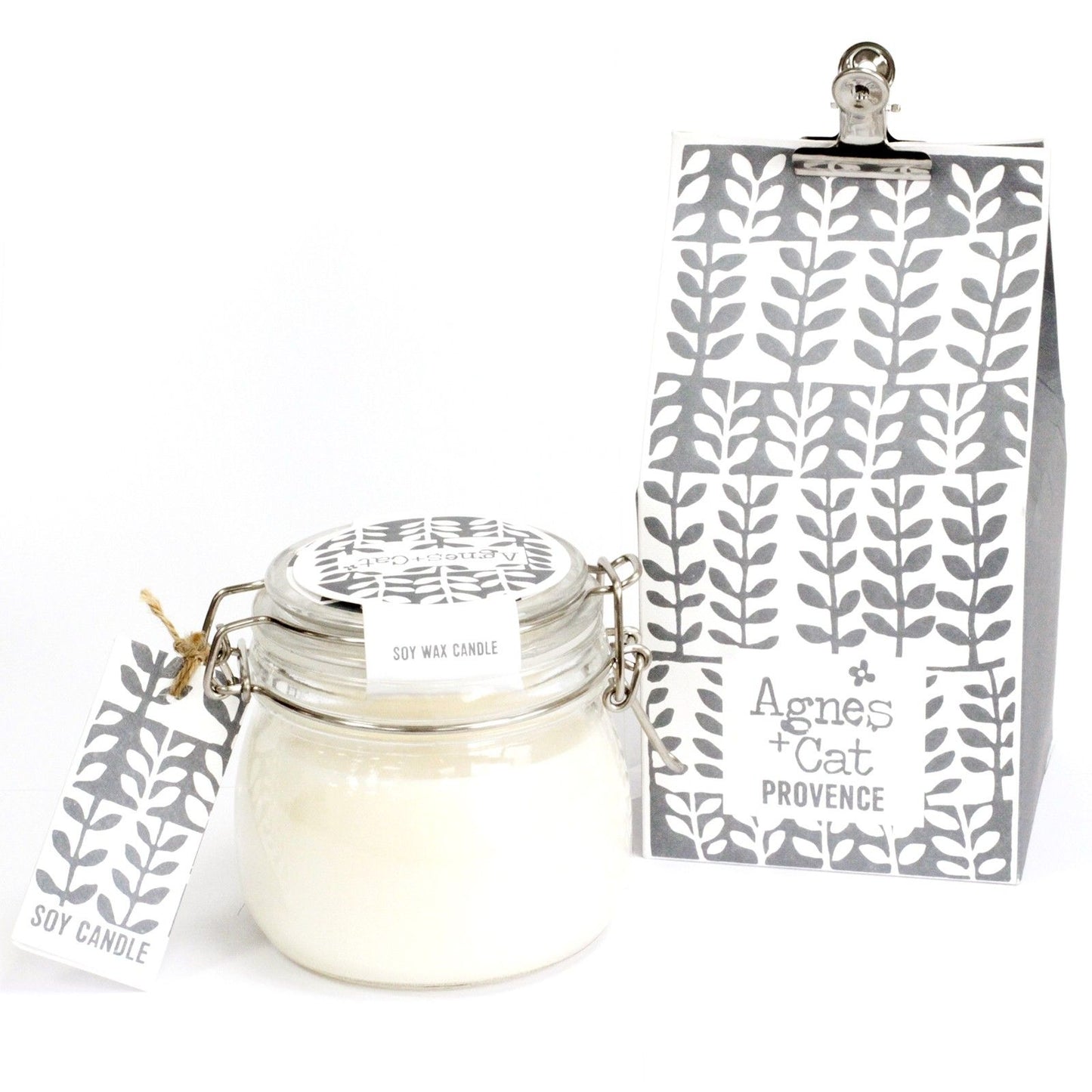 Large glass kilner jar candle filled with white soy wax and a single wick on a neutral background.