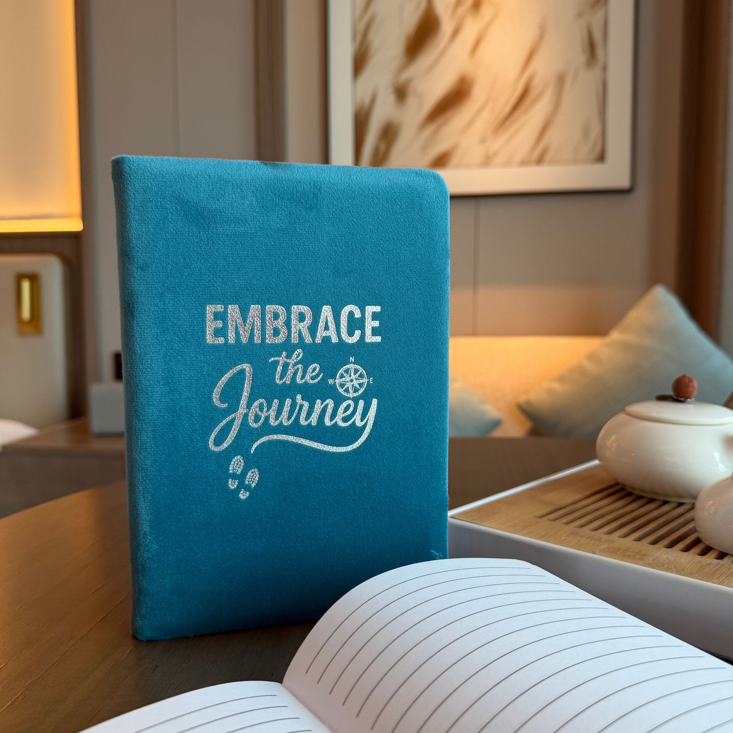 Luxurious light blue velvet notebook with 'Embrace the Journey' embossed in silver on the front cover.