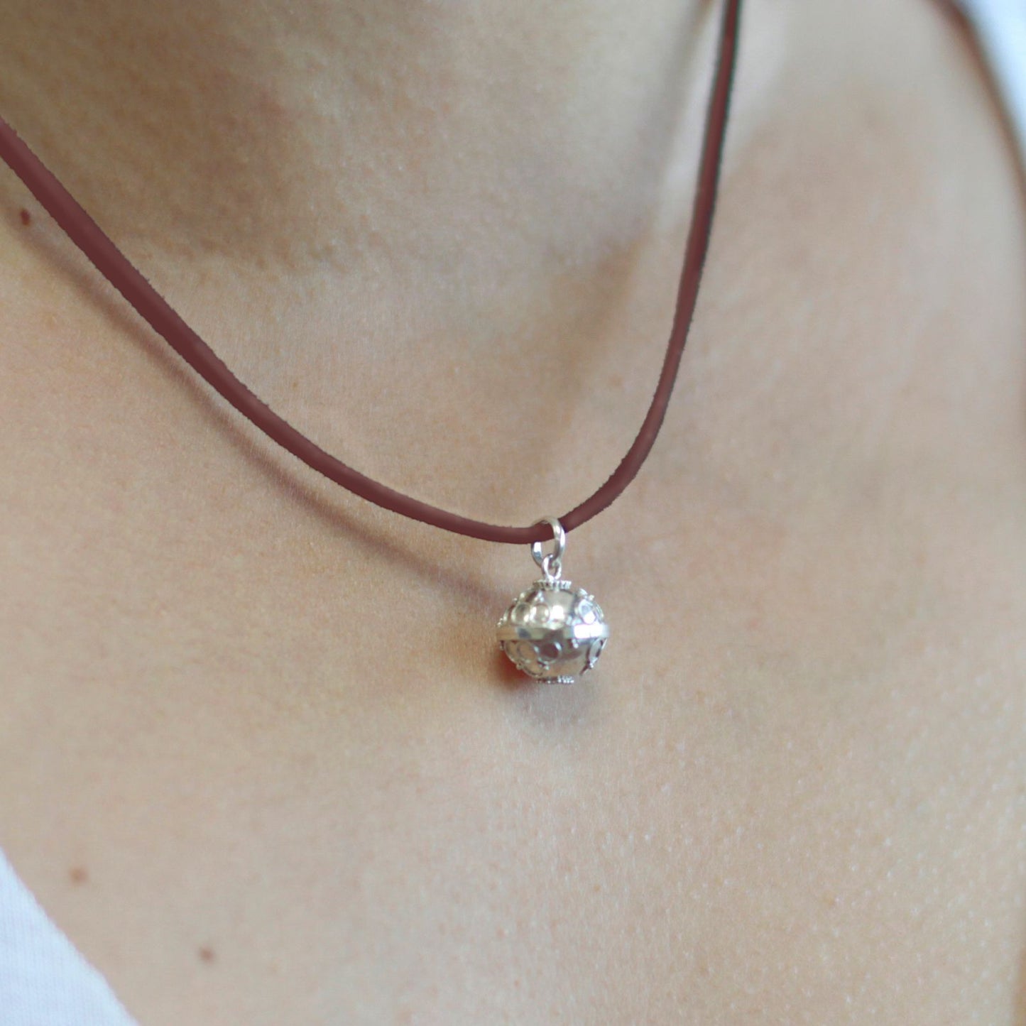 Small 12mm 925 sterling silver angel bell pendant with intricate decorative details.