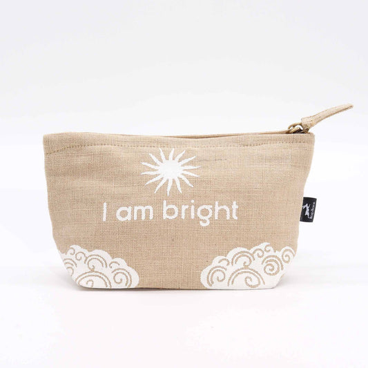 Small natural jute drawstring pouch featuring a printed positive affirmation and decorative sun motif.