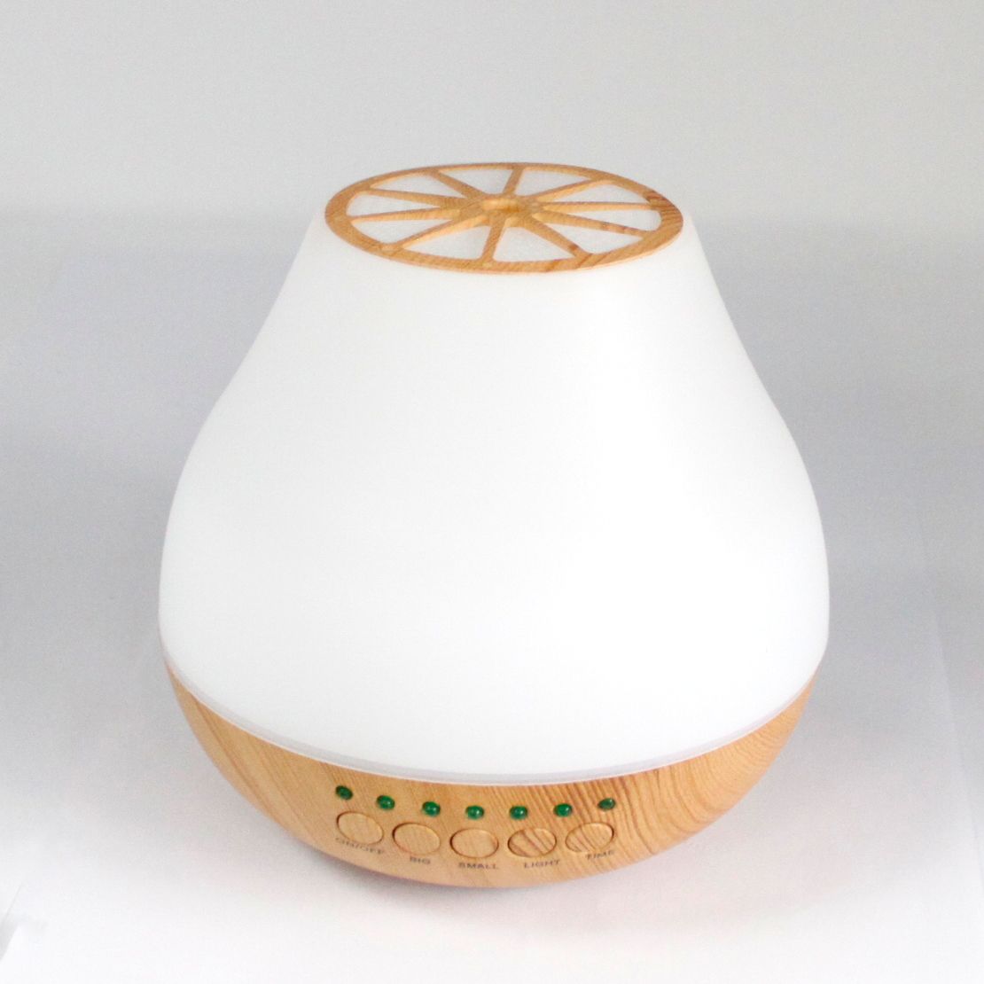 Elegant ultrasonic aroma atomiser with a sleek design and vibrant colour-changing LED light ring.