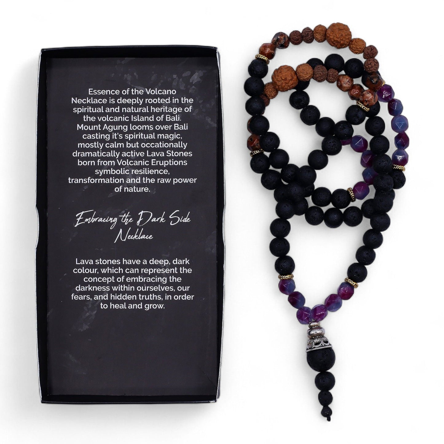 A striking necklace with deep black lava stones and vibrant gemstone accents on a dark cord.