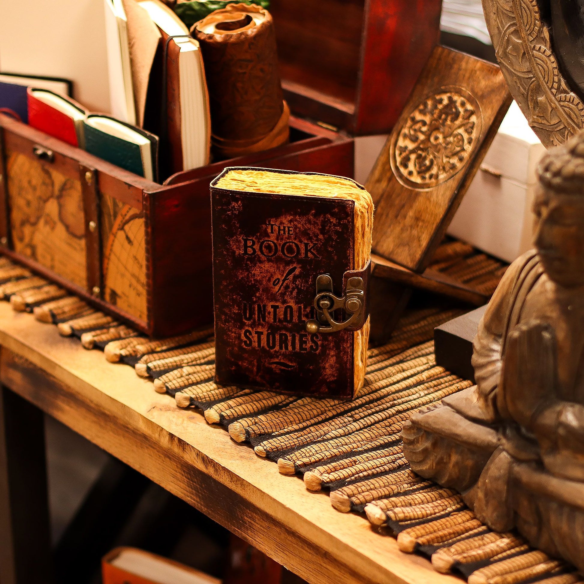 Handmade brown leather notebook with 'The Book of Untold Stories' embossed on the cover and a vintage brass clasp.