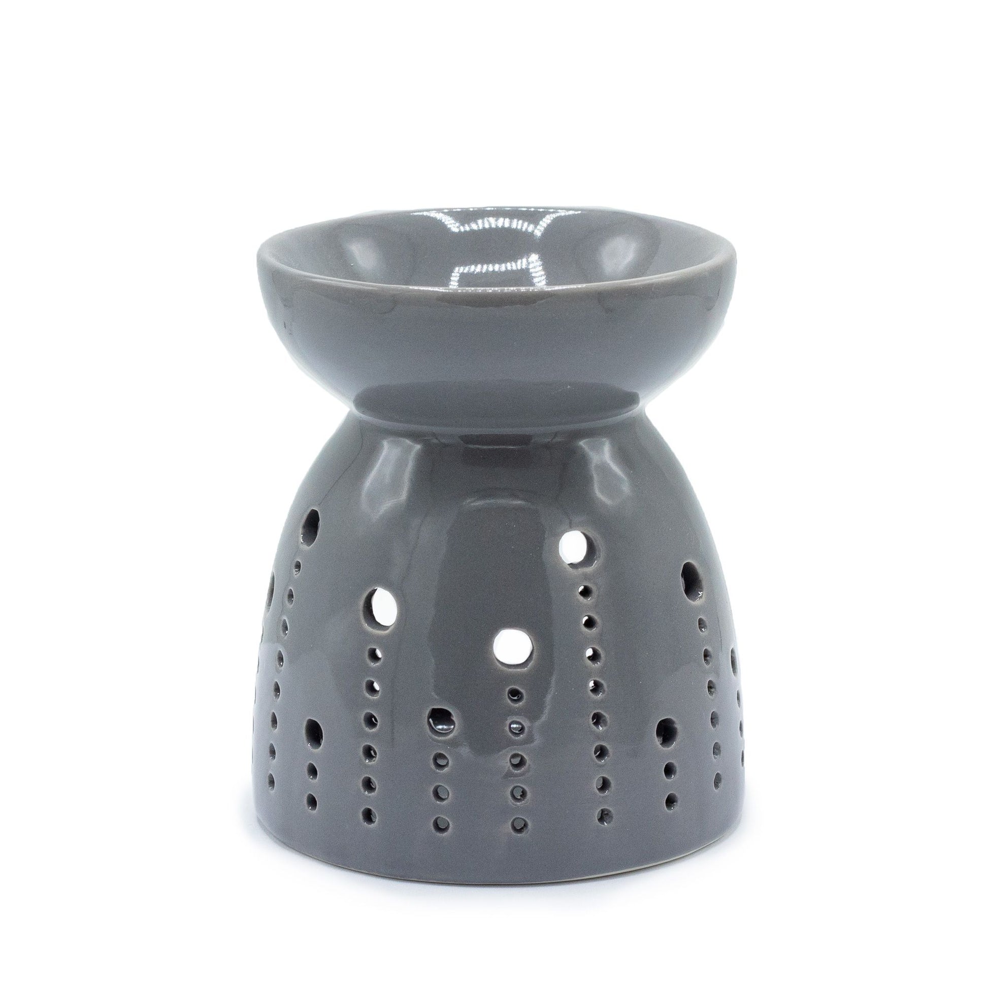 Minimalist grey ceramic oil burner with decorative circular bubble cutouts and a deep well for fragrance oils.