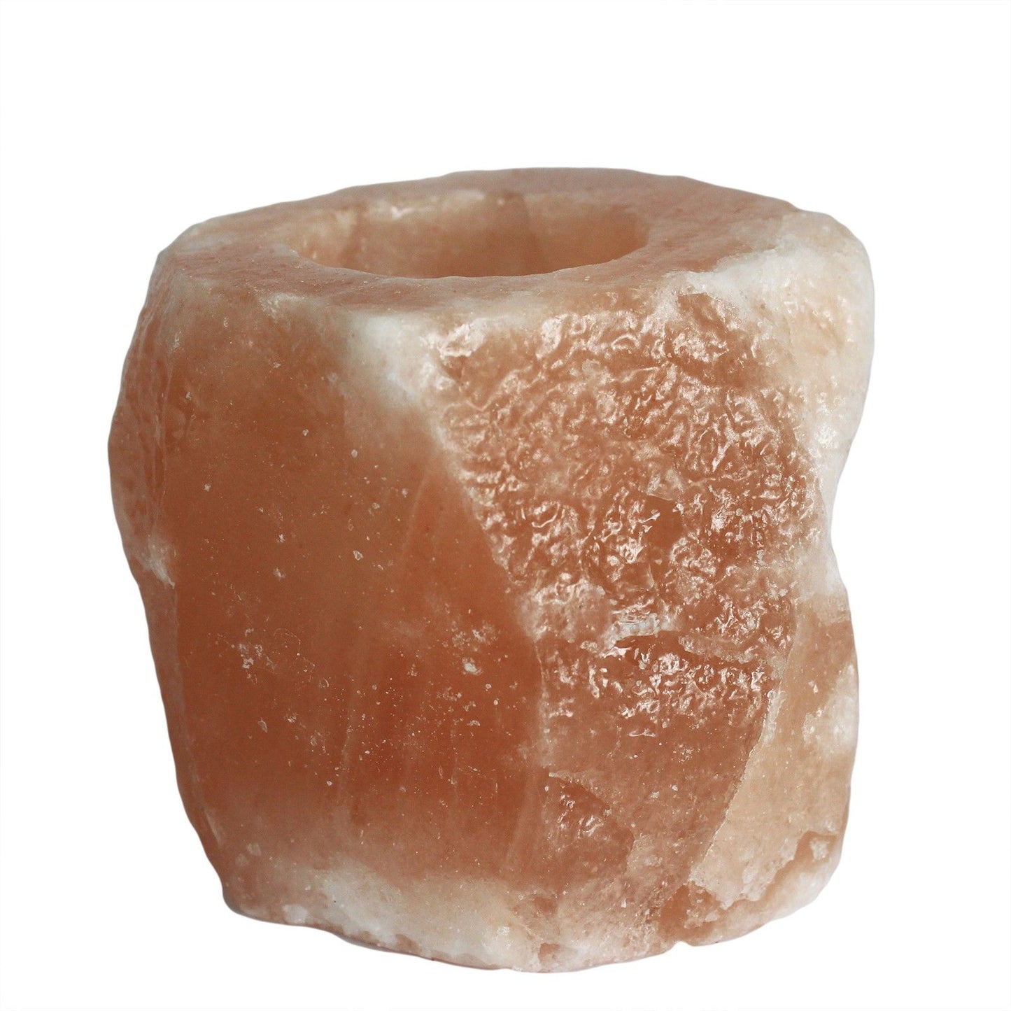 Handcrafted natural pink Himalayan salt tea light candle holder with a rough textured finish.