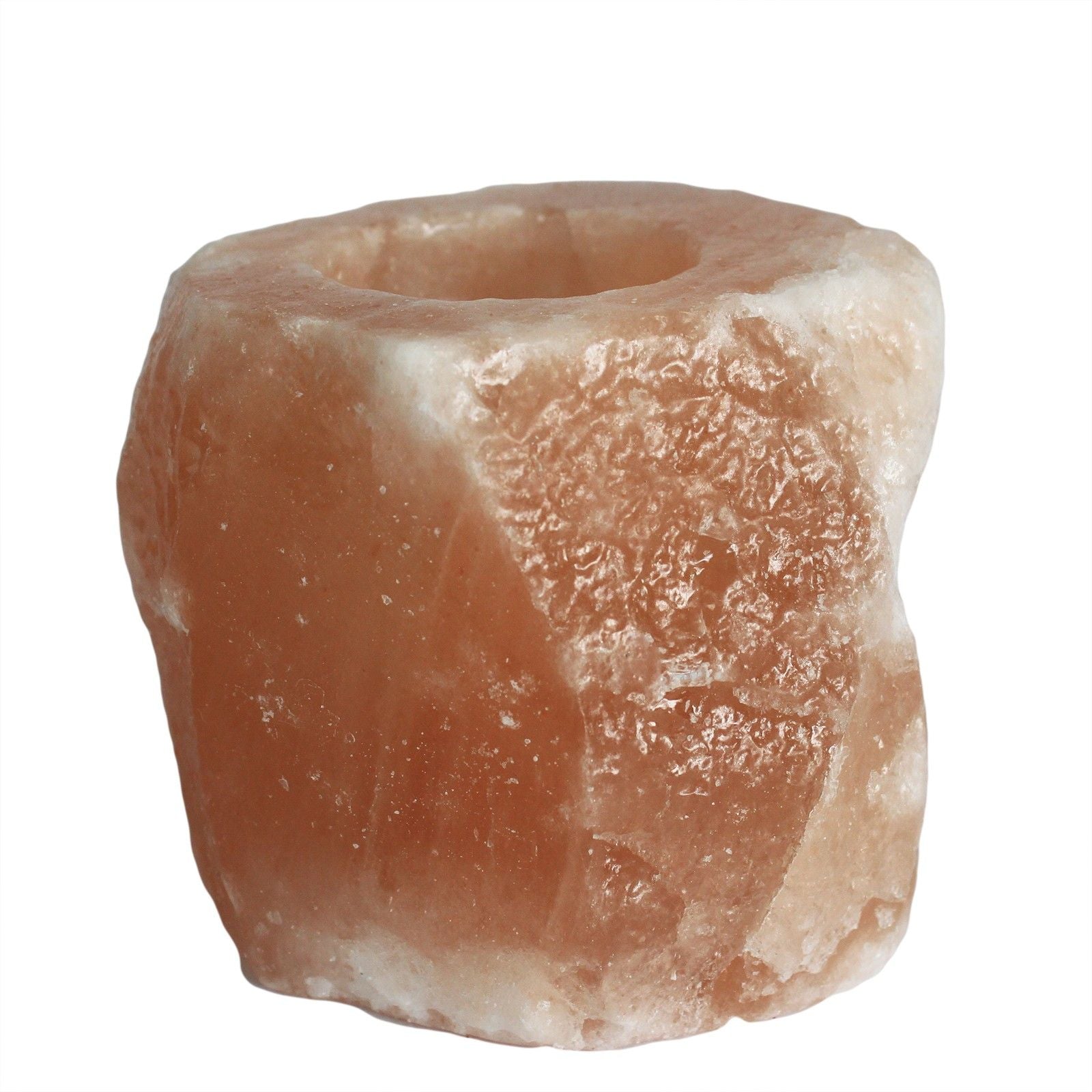 Handcrafted natural pink Himalayan salt tea light candle holder with a rough textured finish.