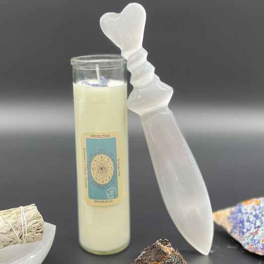 Large hand-carved selenite ritual knife featuring a decorative spiral handle and a smooth, pointed translucent blade.