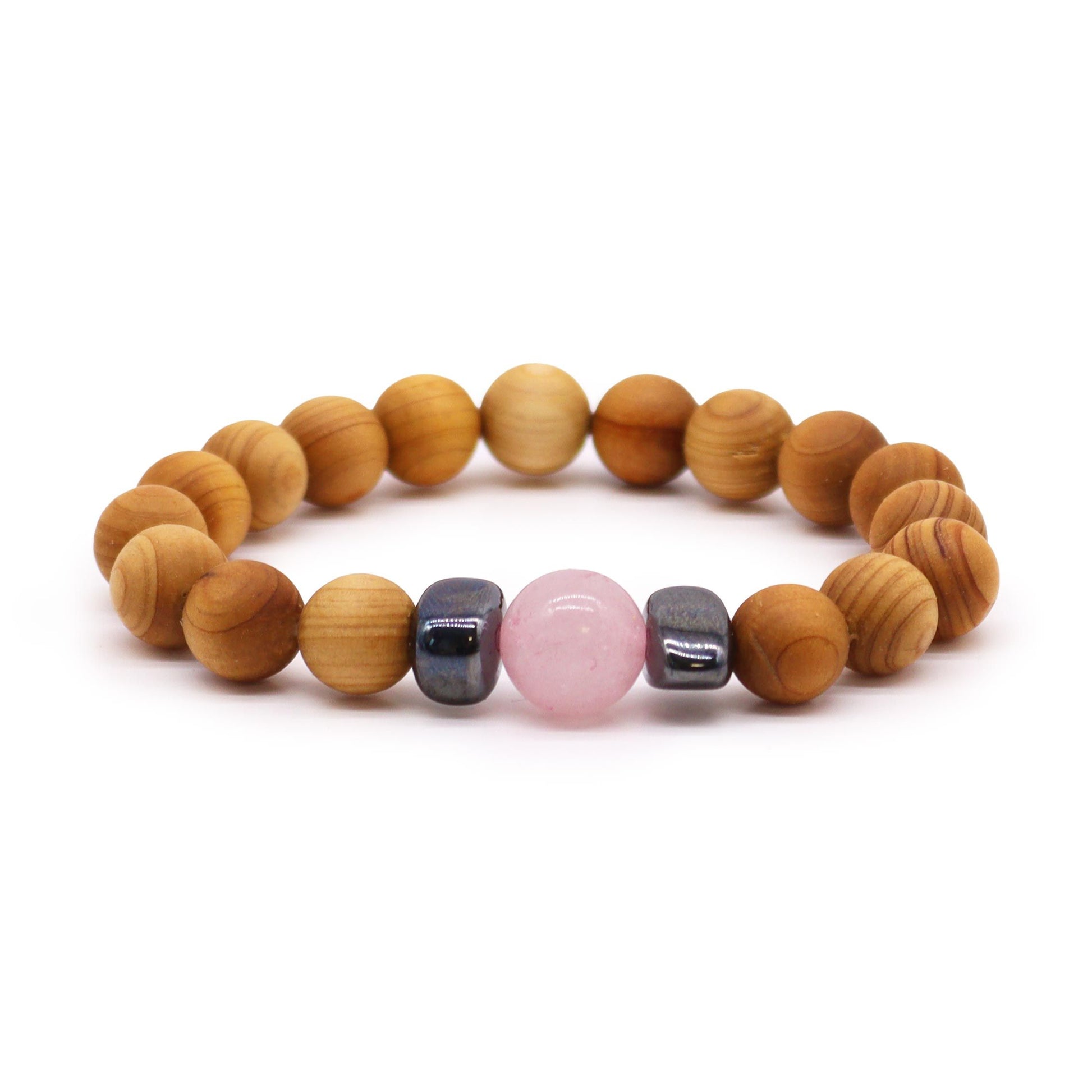 Handcrafted cedarwood bead bangle featuring a soft pink rose quartz stone for heart chakra healing.