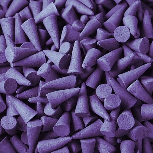 Pile of large purple incense cones with a smooth finish.